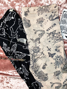 these are biker shorts with a celestial tarot and astrology pattern